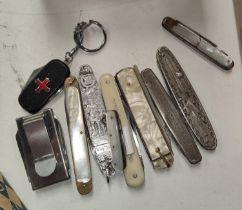 A number of vintage pocket knives and other collectables