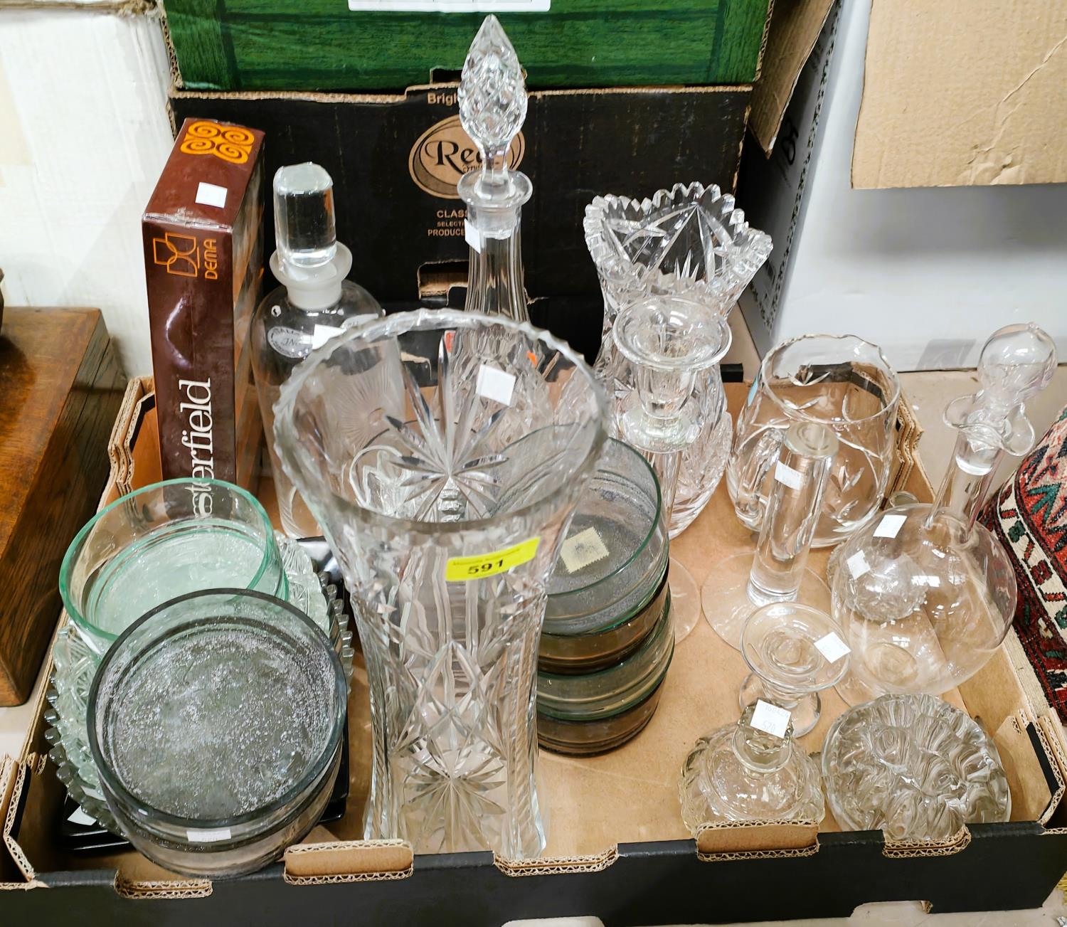 A large selection of cut and moulded glassware including vases, bowls, candlesticks etc, dishes etc