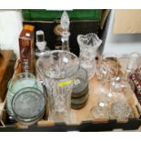 A large selection of cut and moulded glassware including vases, bowls, candlesticks etc, dishes etc