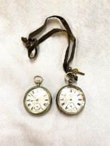 An open faced keywound hallmarked silver gents pocket watch; a base metal pocket watch by "Elgin" (