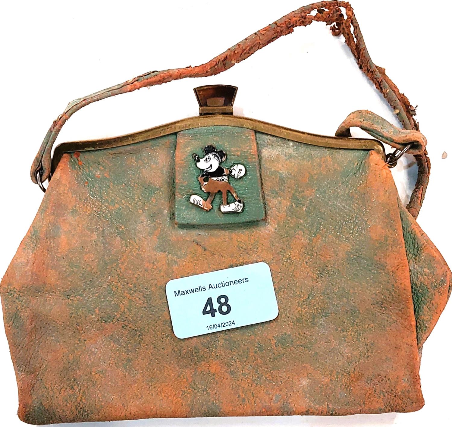 A 1930's unusual leather purse set with an enamel depicting an early Mickey Mouse (enamel a.f.,