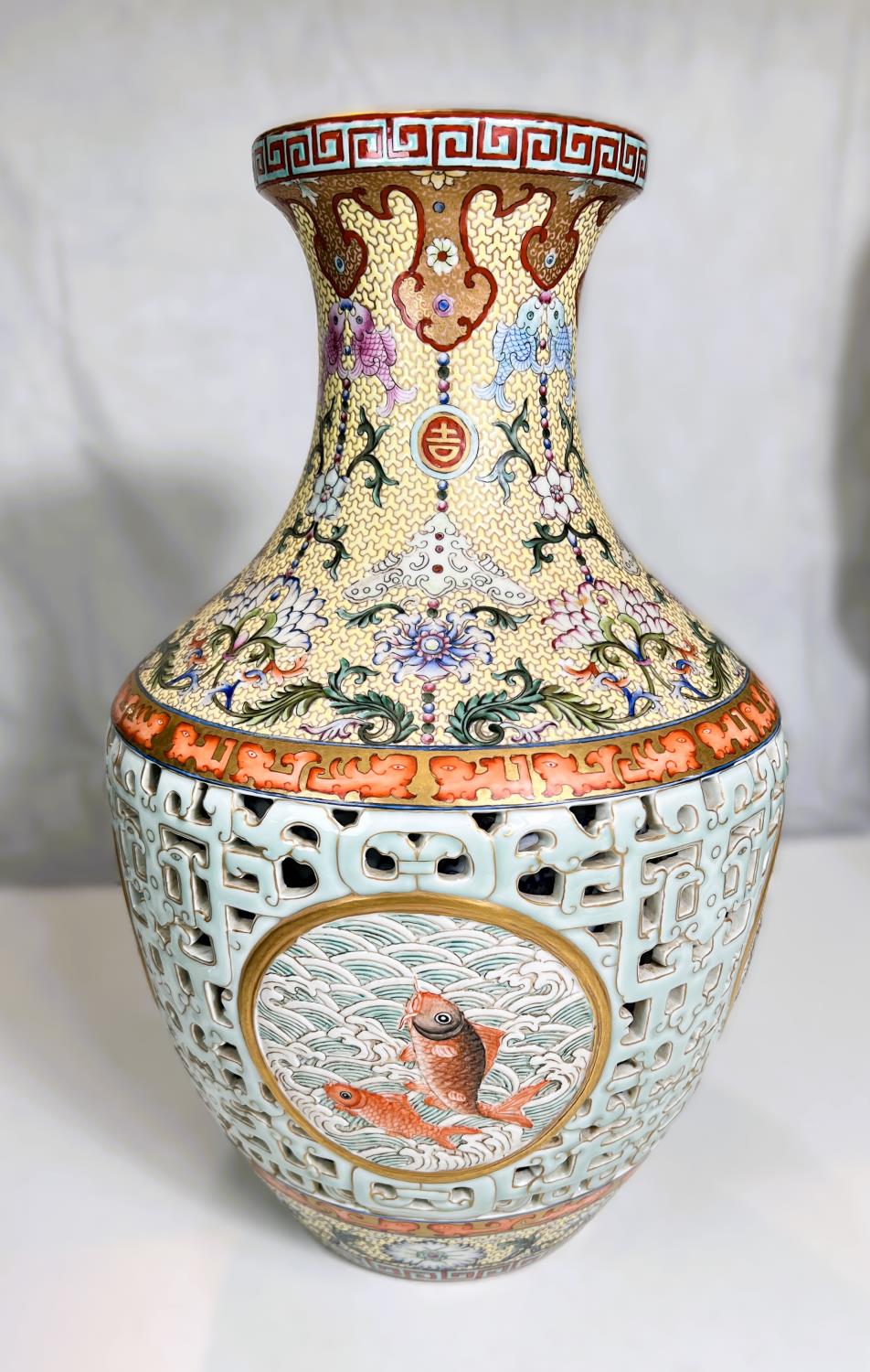 A large and impressive Chinese vase with pale blue rearticulated body with decorated inner body,