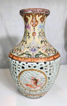 A large and impressive Chinese vase with pale blue rearticulated body with decorated inner body,