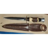 An Early 20th century Fairbairn style fighting knife with horn handle and leather sheath