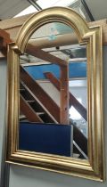 Two wall mirrors in gilt arch top frames