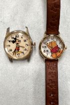 A vintage 'Mickey Mouse' wristwatch (no strap) and a Timex Winnie the Pooh child's watch
