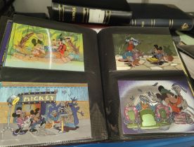 Two albums containing 350+ Disney related postcards