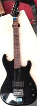 A vintage Encore electric guitar black body with Gorilla Amplifier