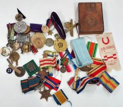 A quantity of medals bits and pieces