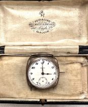 An early 20th century gent's Rolco wristwatch in white metal, with white dial, Arabic numerals (