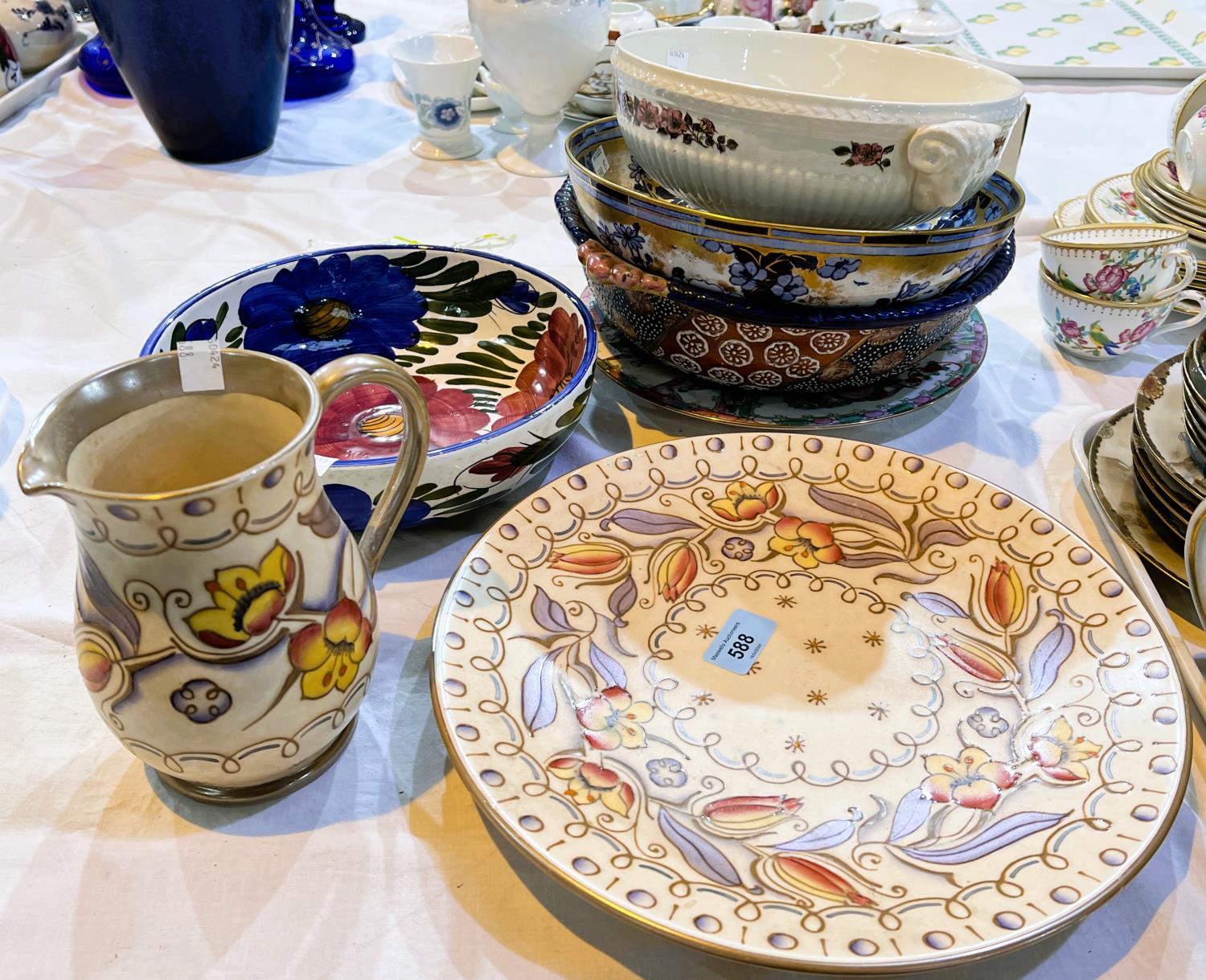 A Charlotte Rhead large charger (chip to back of rim) and jug; decorative bowls and dishes