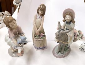 Two Lladro groups:  girl on donkey with flowers in panniers, impressed 5465, height 17cm; girl