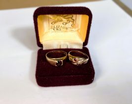 Two 9ct gold dress rings set with garnet coloured stones, 4.6gms
