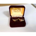 Two 9ct gold dress rings set with garnet coloured stones, 4.6gms