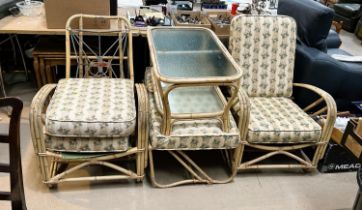 A vintage mid century bent wood reclining pair of conservatory chairs with foot rest and a coffee