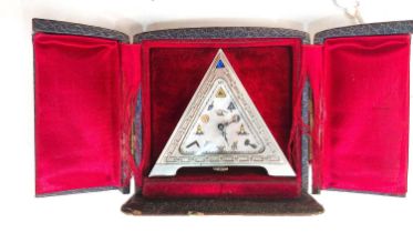 A MASONIC CLOCK the 925 standard case of triangular form, mother of pearl face with engraved