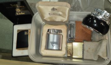 A vintage Ronson cigarette lighter, boxed; 4 others