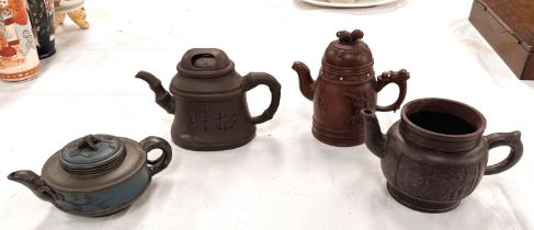 A Yixing teapot, no lid, impressed mark to base, height 10cm; a similar squat teapot with lid;