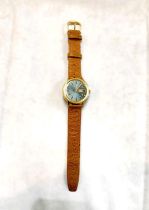 A Bucherer automatic, gold plated gents watch with blue dial on a replacement leather strap.