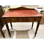 A Victorian mahogany hall / side table with 2 frieze drawers and turned legs