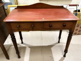 A Victorian mahogany hall / side table with 2 frieze drawers and turned legs