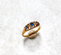 An 18 carat hallmarked gold ring with 3 sapphires and 2 diamonds alternately in raised claw setting,