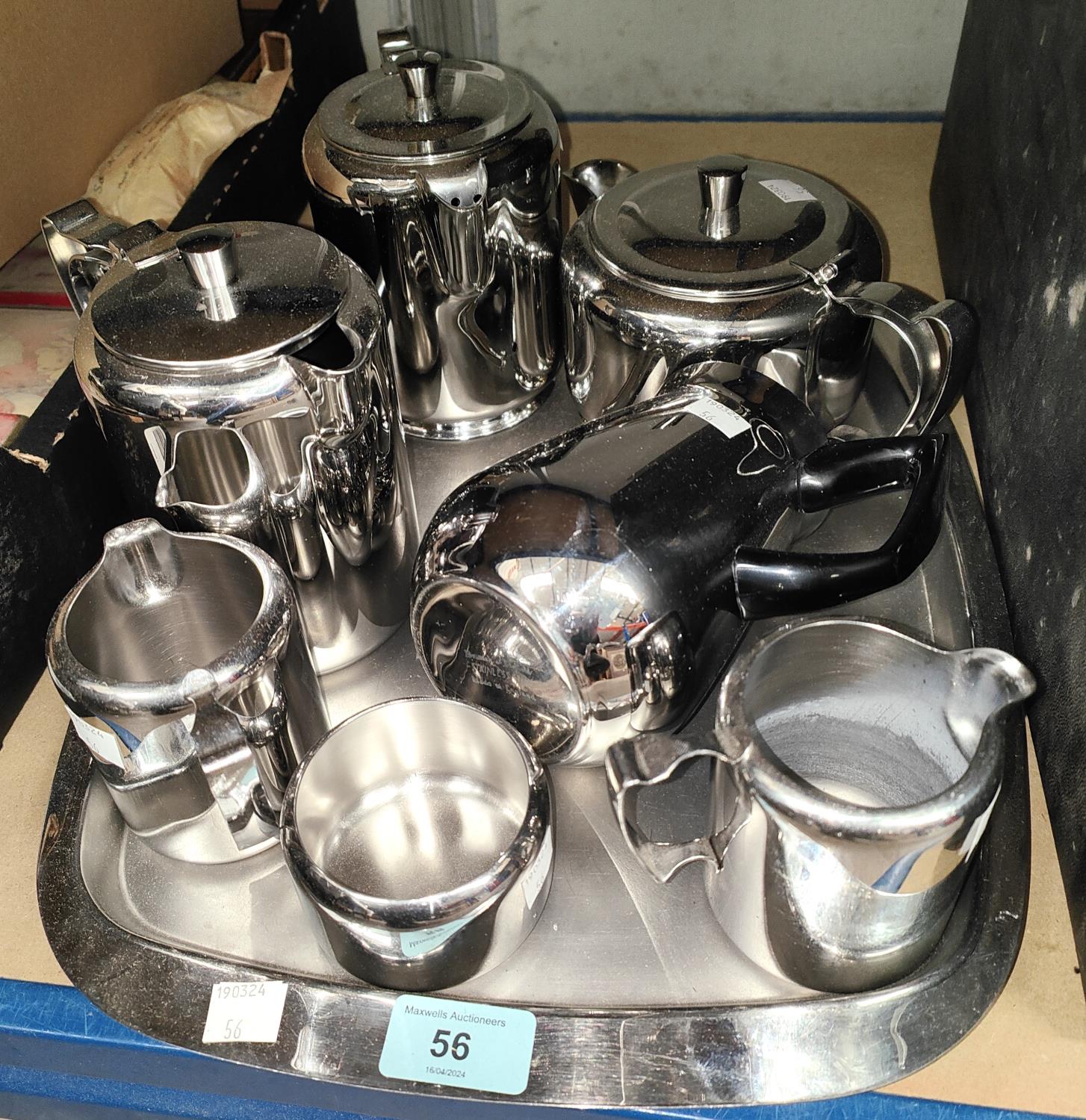 A 7 piece stainless steel tea/coffee service on a tray