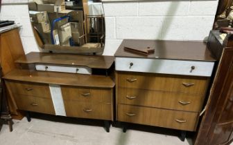 A 1950's / 60's straight walnut 2 piece bedroom suite on ebonised legs including dressing table of 6