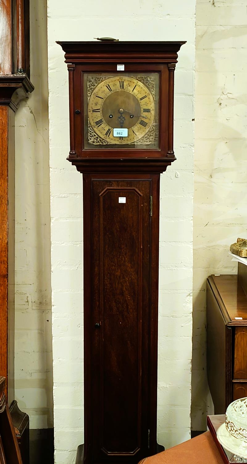 A mahogany cased, brass dial, granddaughter clock with chiming movement.