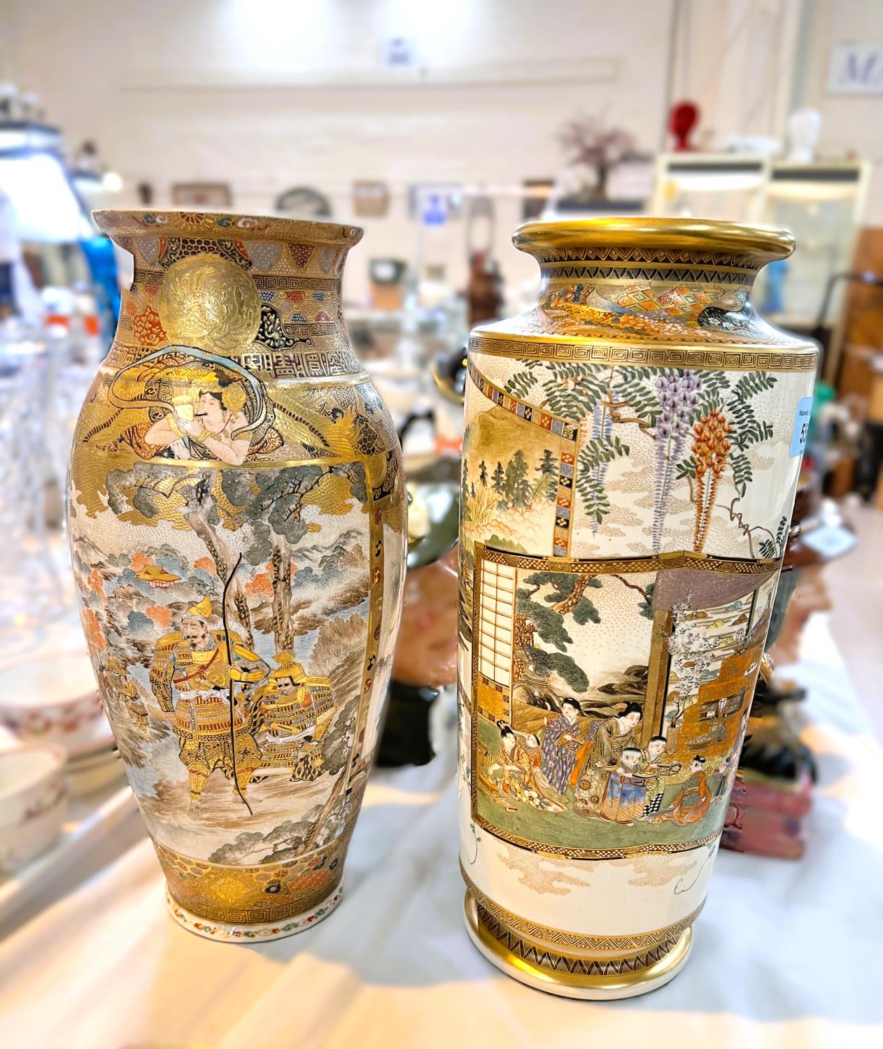 Two early 20th century Japanese satsuma vases decorated with panels of warriors and women &