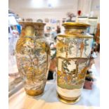 Two early 20th century Japanese satsuma vases decorated with panels of warriors and women &