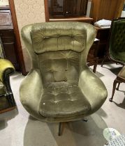 A 1960's 'Egg' swivel armchair re-upholstered in green fabric (sold as design collector item only)