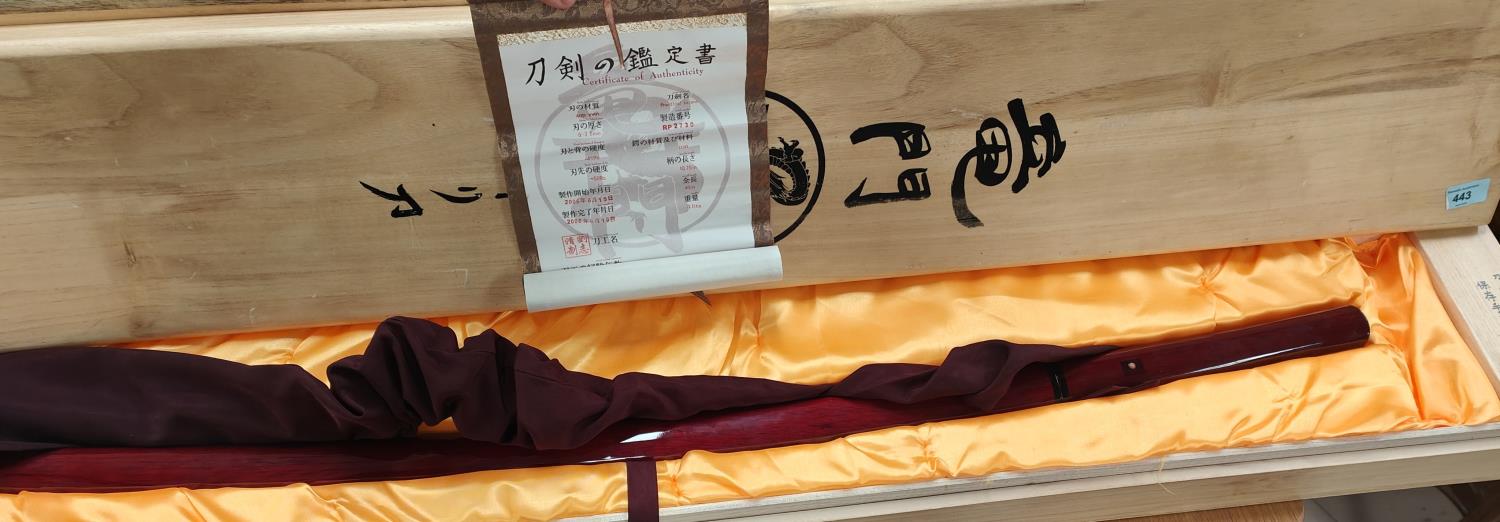 A 20th century hand forged Ryumon Japanese sword with certificate in wooden presentation box