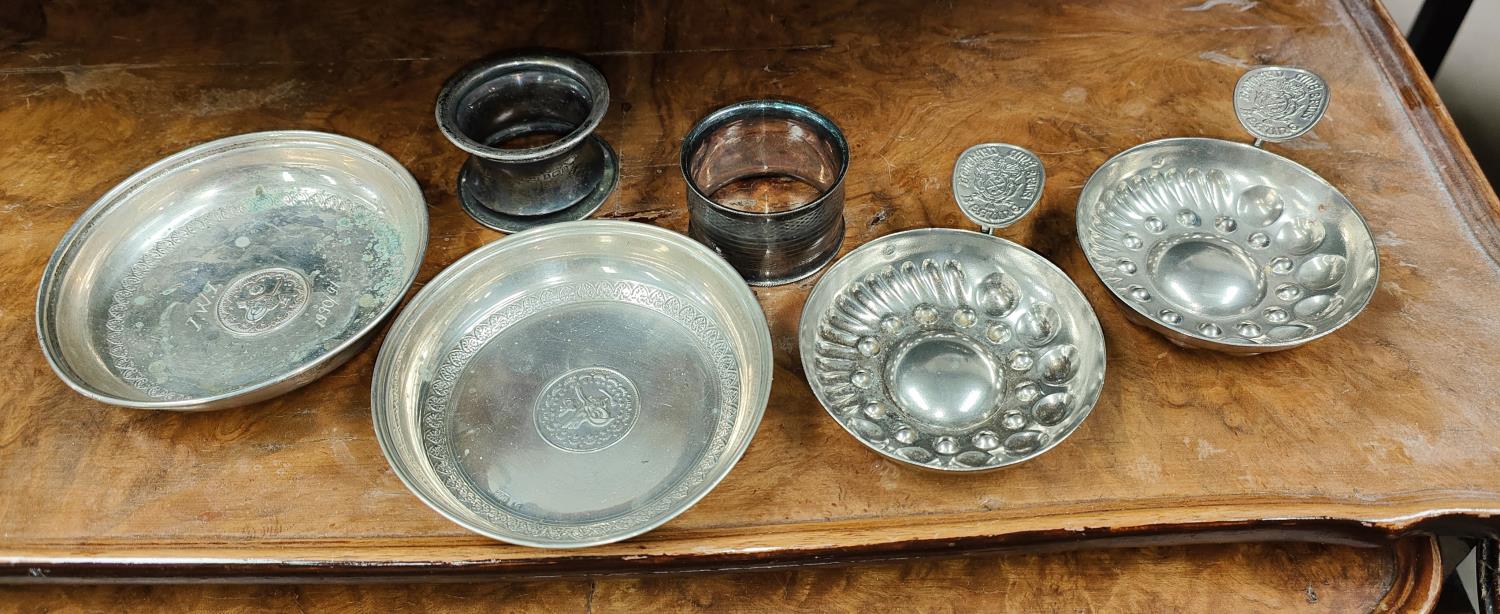 Two Middle Eastern white metal dishes with central coins stamped 800 1.5oz and two wine tester