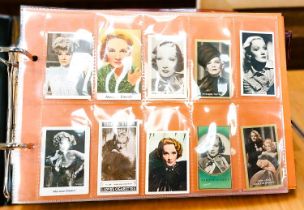 Two albums containing a collection of cards; etc., relating to Marlene Dietrich, one 15 pages, one