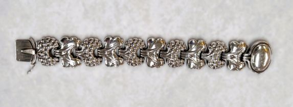 Georg Jensen:  a 10 link bracelet with stylised vine motifs, oval clasp, stamped '925 sterling, 30',