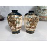 A small pair of Japanese satsuma vases, + dark turquoise ground with warrior to each panel,