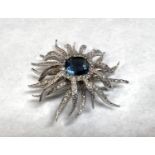 A blue cushion cut and clear paste "sunburst", vintage 1960's impressed 'Jomaz', width 6cm