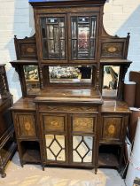 A 19th century full height rosewood side cabinet with mirror back and extensive marquetry inlay, the