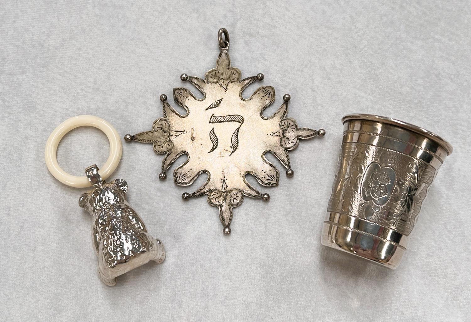 A continental white metal tot cup, marks to base AK 84, 1oz; a steel pendant in the form of a - Image 2 of 3