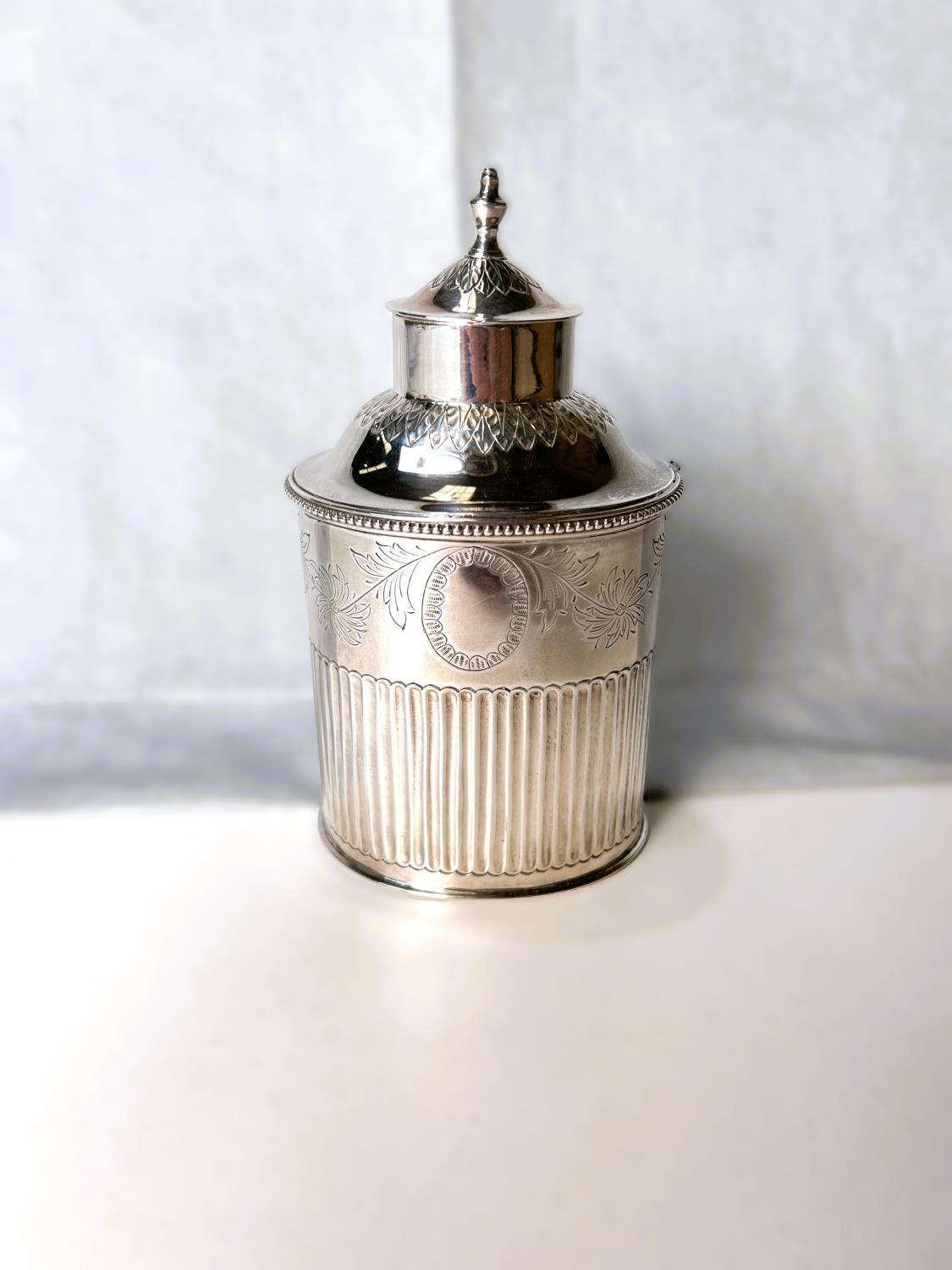 An oval white metal tea caddy with chased decoration, beaded rim and flared lower section marked for - Image 2 of 3