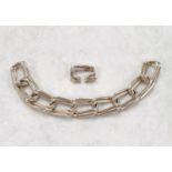 A silver bracelet formed from double rounded rectangular finely rubbed links with detaching lock