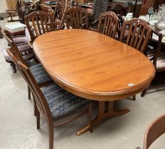 A Staf light teak extending dining table with extra interior leaf and a set of 6 (4+2) chairs