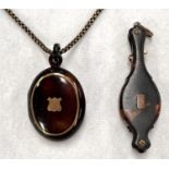 A pair of 19th century folding lorgnettes in tortoiseshell case; a tortoiseshell locket with