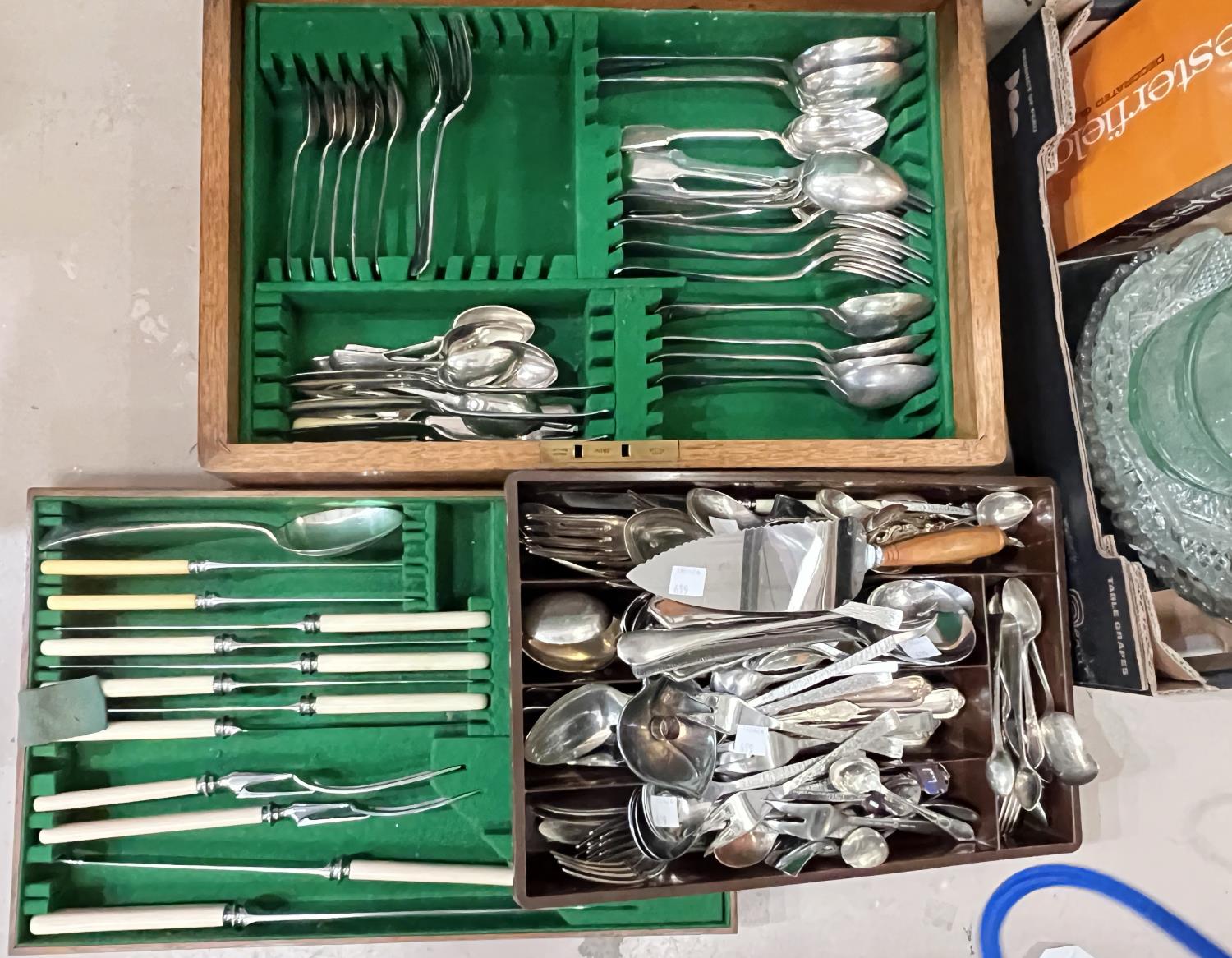 A part canteen of cutlery in fitted oak box; loose cutlery