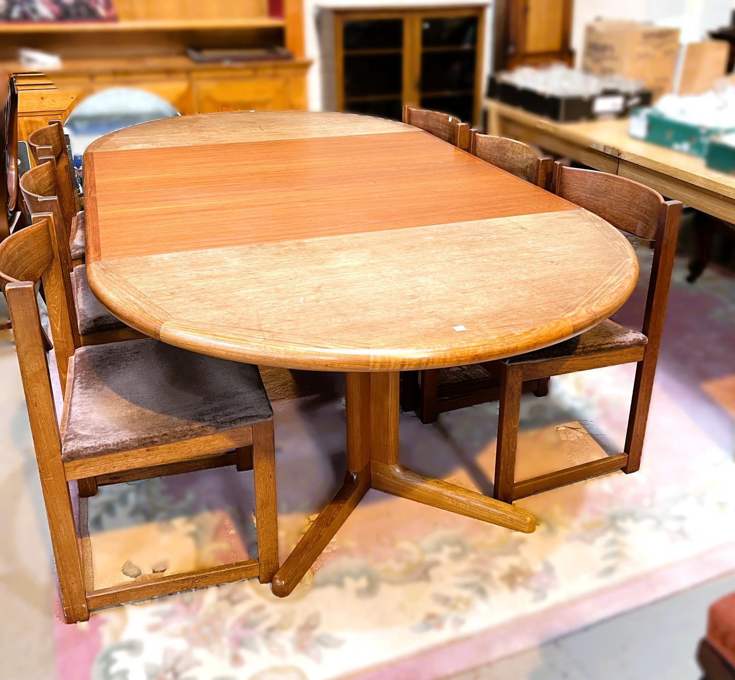 A large 1970's G-Plan oval teak extending dining table, 2 spare leaves, extended length 234cm