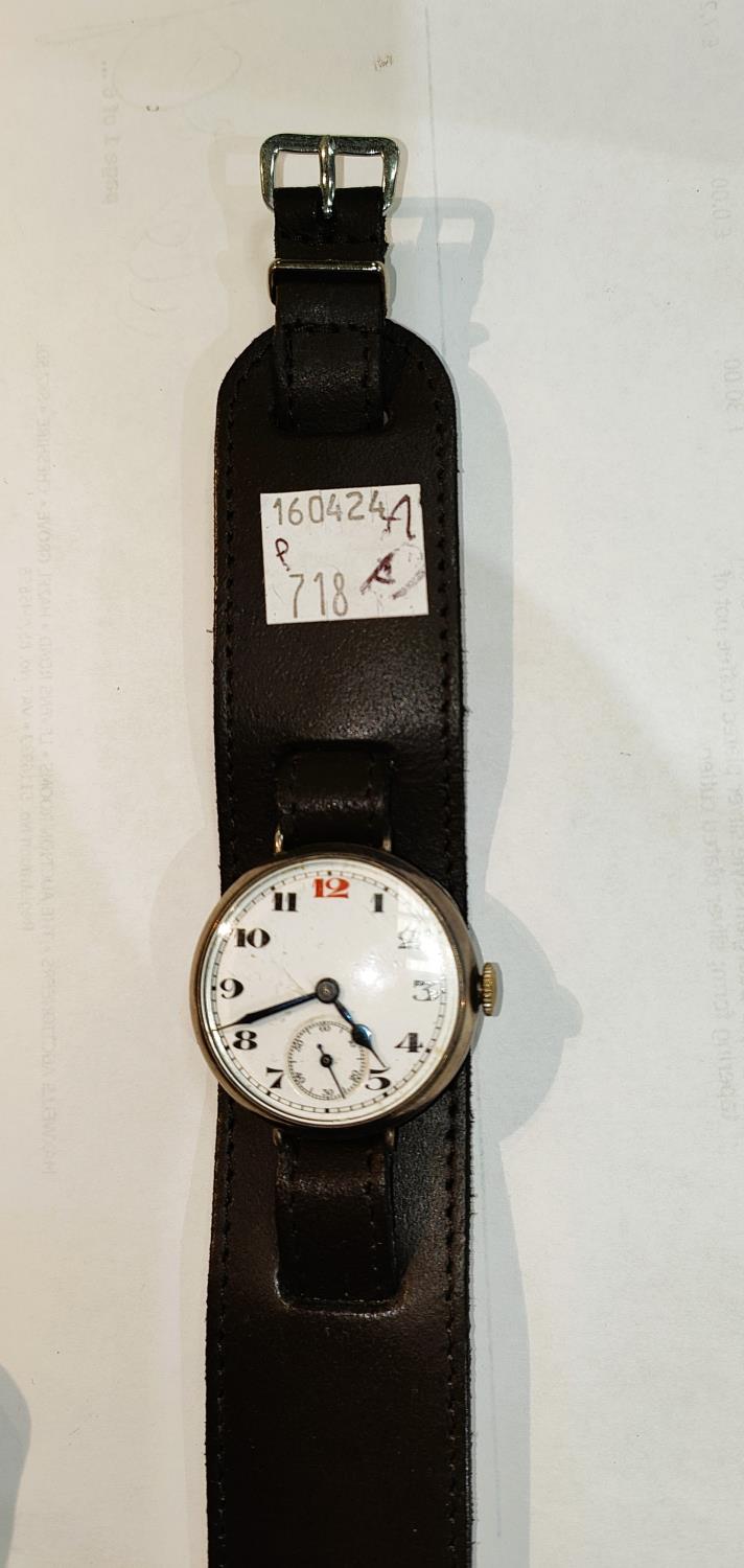 A hall marked silver 1914 gents trench watch with red 12 marker (ticking) on later strap