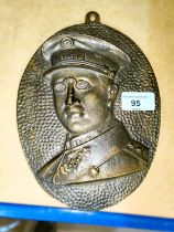 A cast brass plaque commemorating the reign of King Albert I of Belgium 1909-1934, 23cm overall