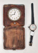 An early wristwatch with colour enamelled dial, case stamped OMEGA, a Swiss travelling clock