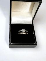 An 18ct white gold dress ring with diamond set heart, stamped 750 3gms and a 9ct yellow gold wedding